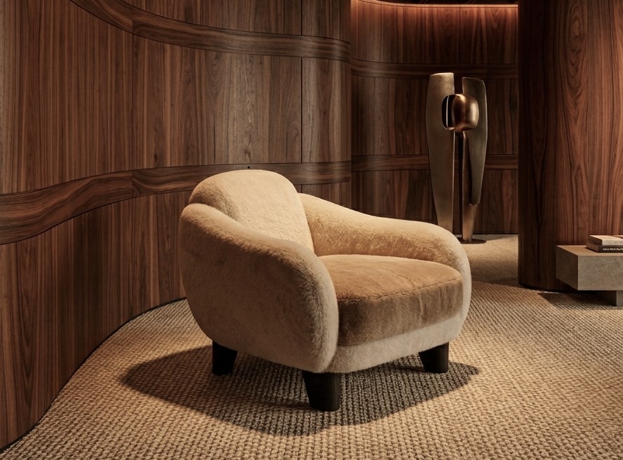 Britto Charette Studio — Boucle Lounge Chair & Curved Walnut Woodwork